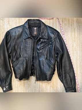Vintage women's black leather motorcycle jacket